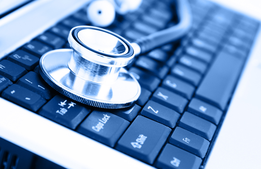 close up of stethoscope on laptop keyboard